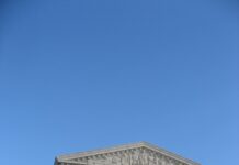 Chief Justice Keeps Title 42 In Place For Now